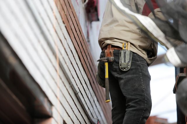 construction worker with hammer and tools